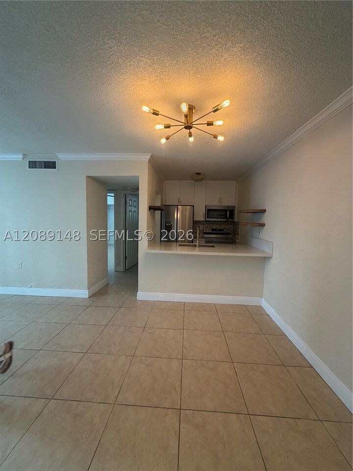Property Photo: 300 Madeira Ave 102 FL 33134