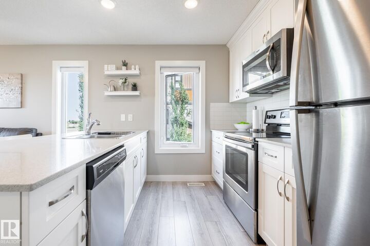 Property Photo:  1203 163 Street SW 2  AB T6W 3X1 