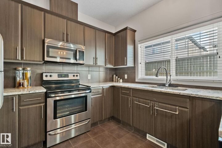Property Photo:  450 McConachie Way NW 17  AB T5Y 0S8 