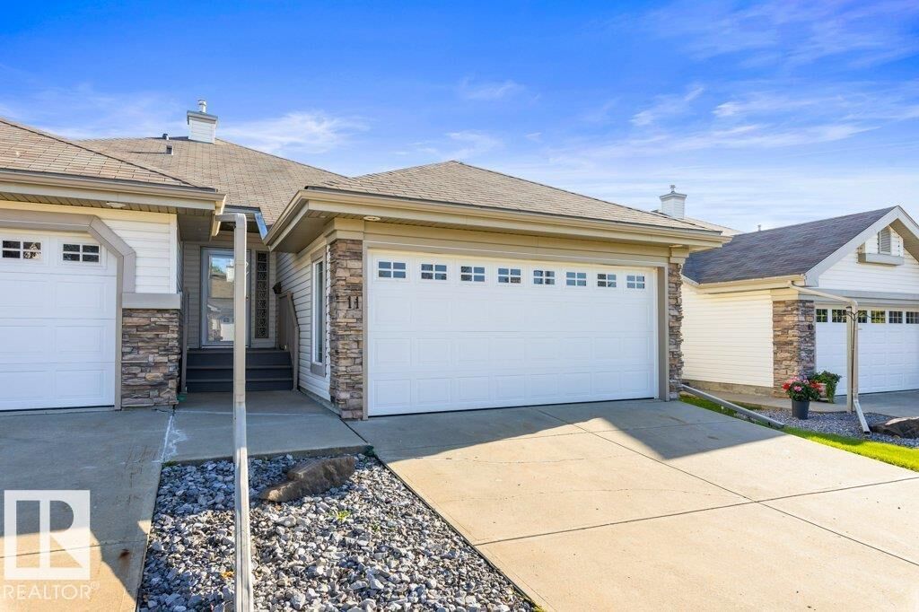 Property Photo: 4 Heritage Way 11 AB T8N 6W3