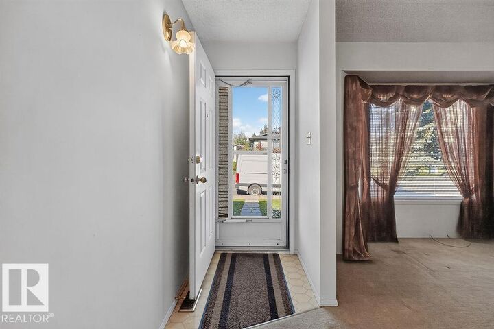 Property Photo:  7423 188 Street NW  AB T5T 5J7 