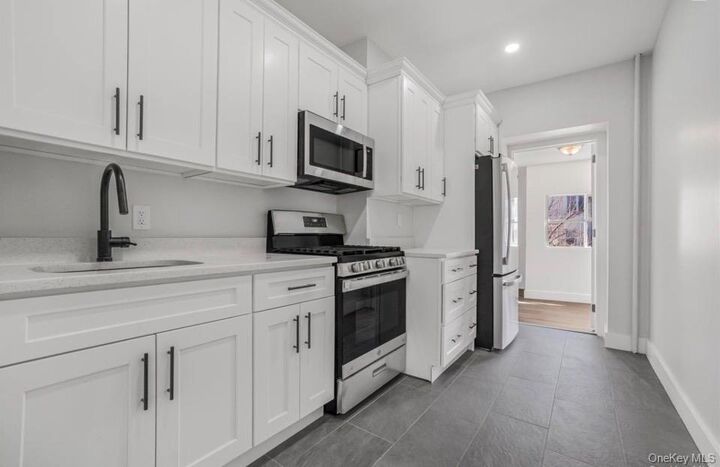 Property Photo:  90-11 77th Street 1  NY 11421 