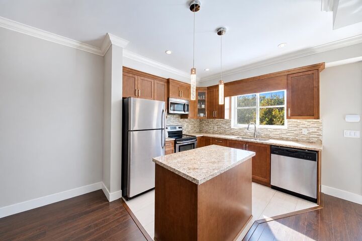 Property Photo:  7159 Stride Avenue 203A  BC V3N 1T8 