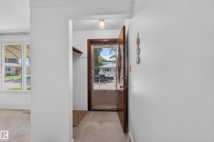 Property Photo:  7704 104 Avenue NW  AB T6A 0Y3 