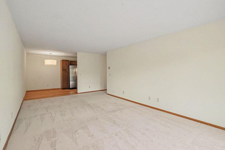 Property Photo:  205 Barry Avenue S 207  MN 55391 