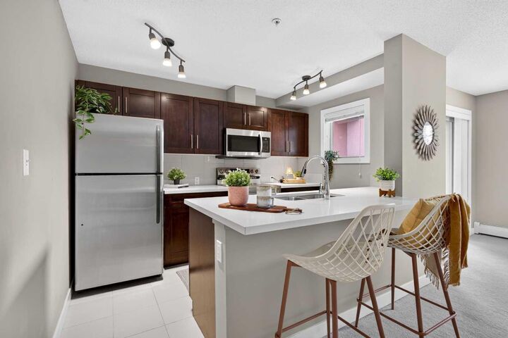 Property Photo: 403 Mackenzie Way SW 2206 AB T4B 3V7