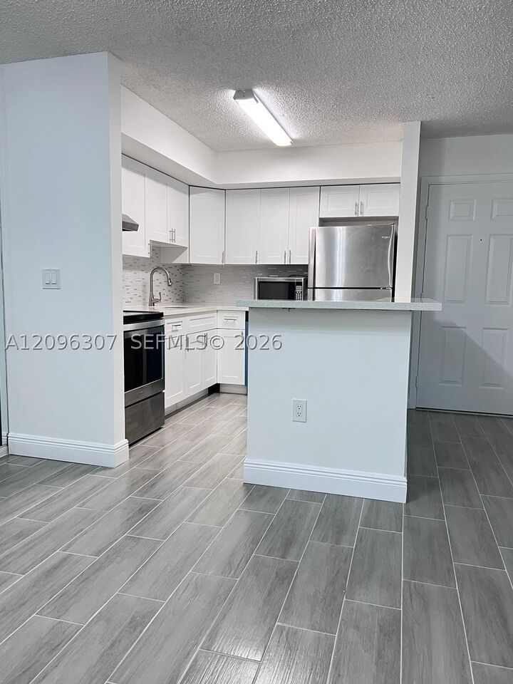 Property Photo:  19055 NW 62nd Ave 111  FL 33015 
