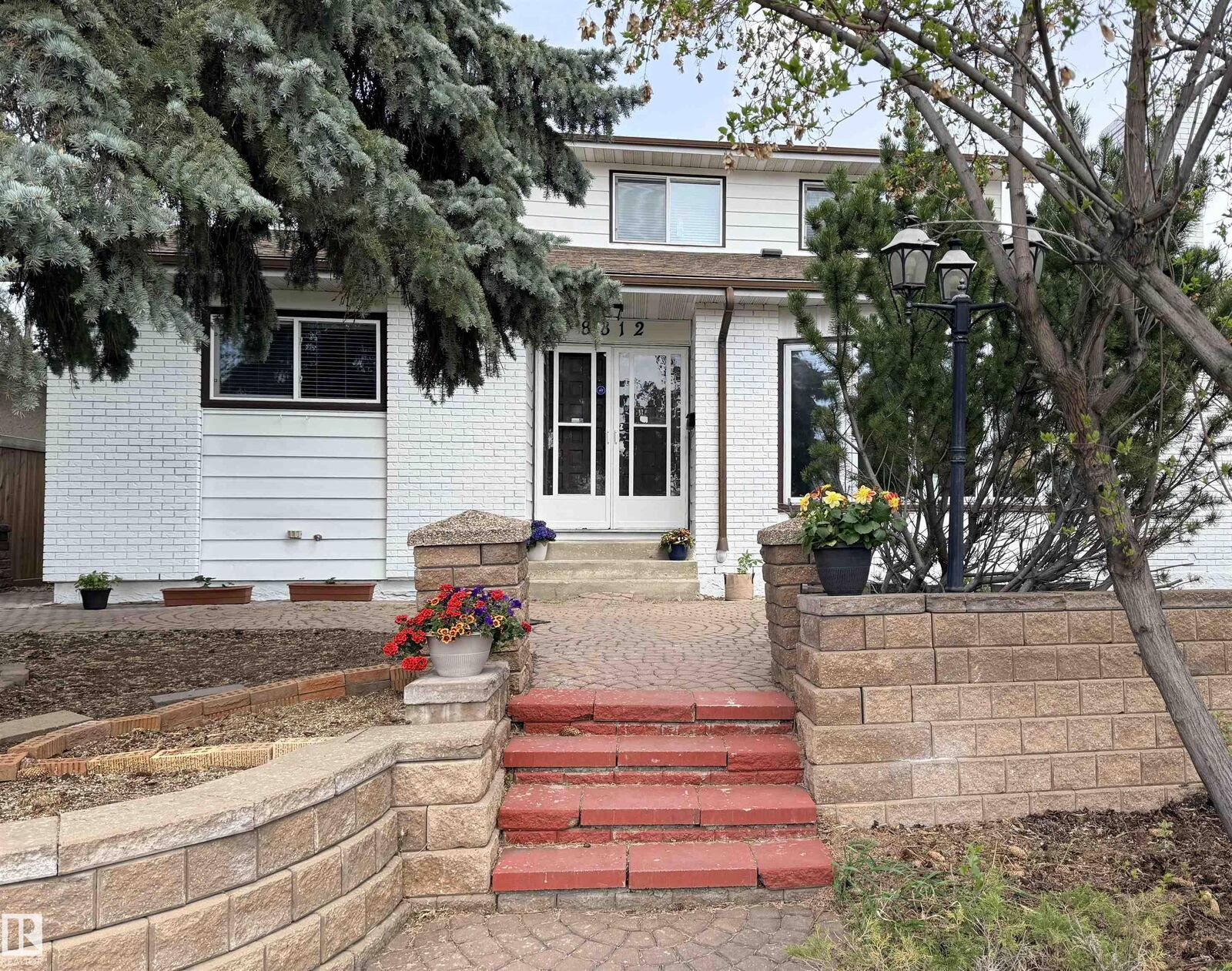 Property Photo:  8812 135 Avenue NW  AB T5E 1N3 