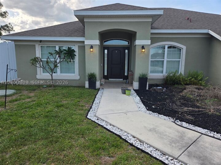 Property Photo:  1005 SW Bay State Rd  FL 34953 