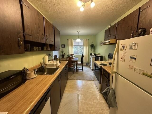 Property Photo:  7426 138 Street 210  BC V3W 6G4 
