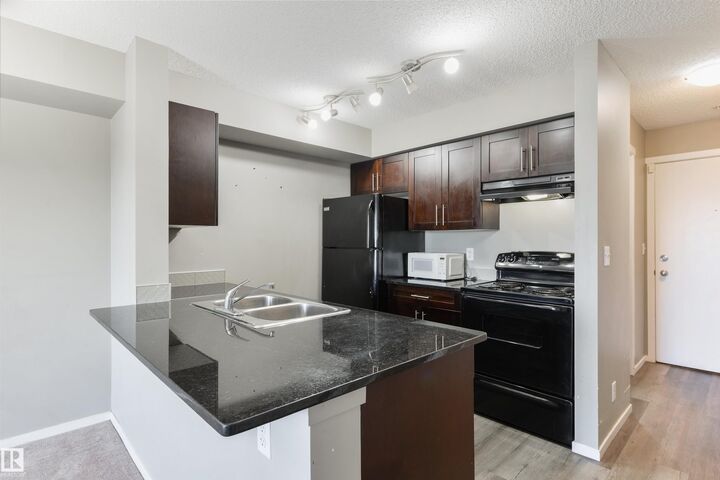 Property Photo: 1510 Watt Drive SW 320 AB T6X 2E6