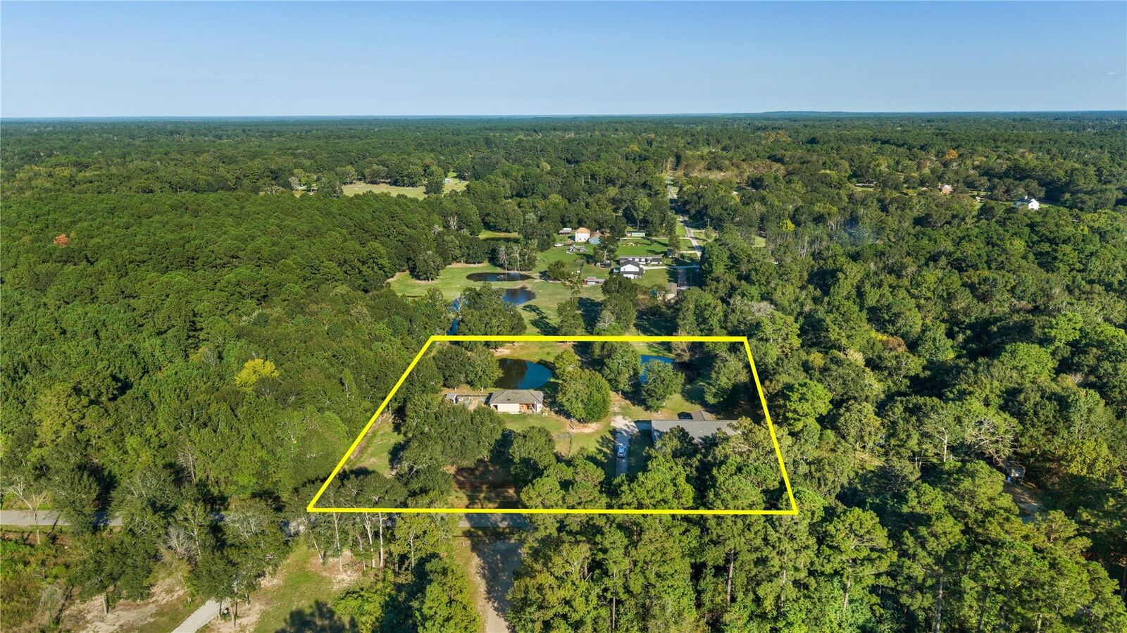 Property Photo:  448 County Road 2235  TX 77327 