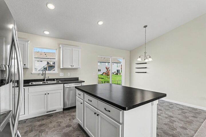 Property Photo:  902 Poplar Lane  MN 55388 