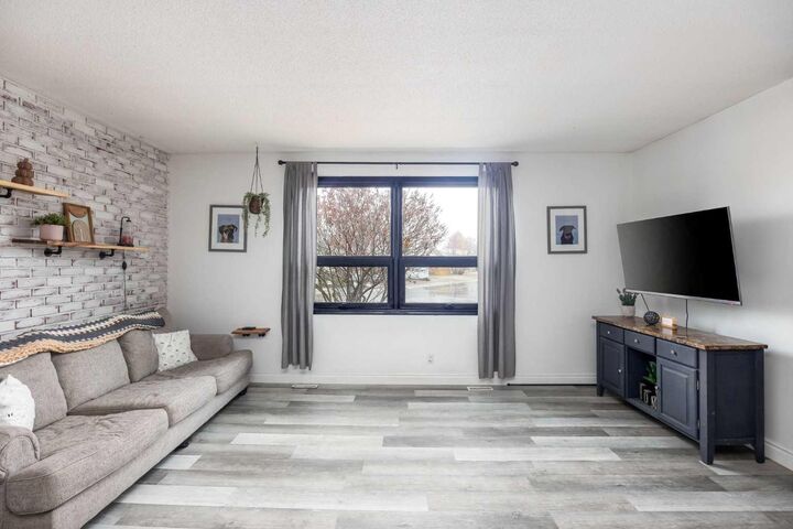 Property Photo: 203 Cochrane Crescent AB T9K 1H1