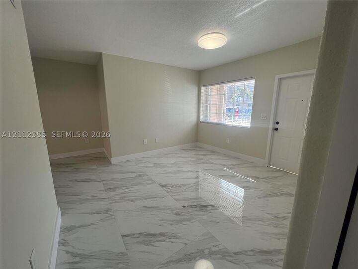 Property Photo:  7201 NW 174th Ter 103  FL 33015 