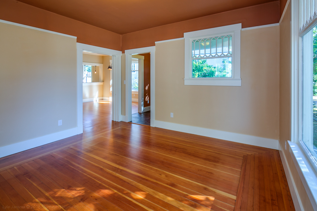 Property Photo: Looking toward the front entry, and the formal dining room where there is a wooden pocket door at the large opening to close off this room from the dining, if so desired. the lath and plaster has been replaced with sheet rock. 2220 Utter St  WA 98225 